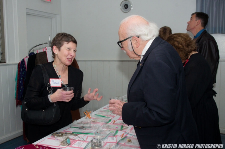 Guests browsing items at the silent auction at the Kabultec 2016 benefit dinner.