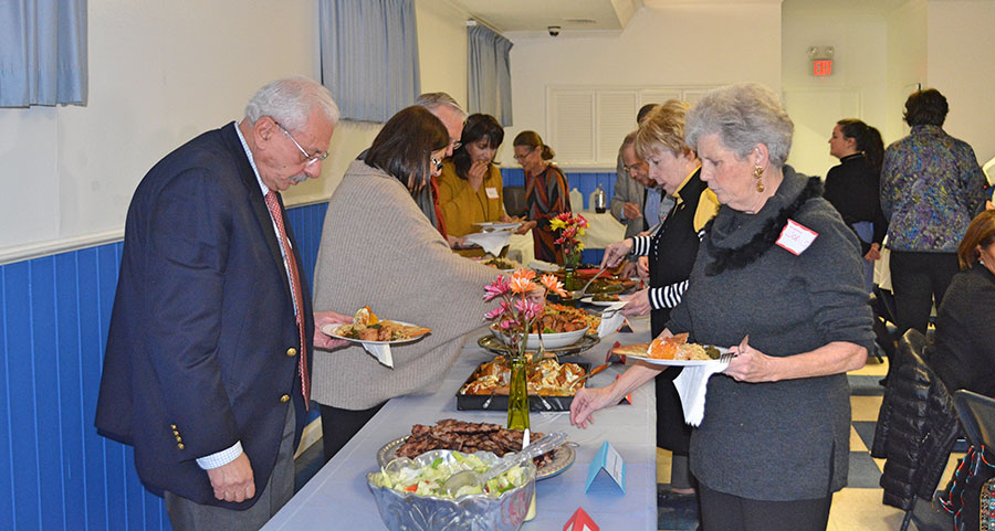 Kabultec supporters sample the buffet items at the 2017 Kabultec Benefit Dinner.